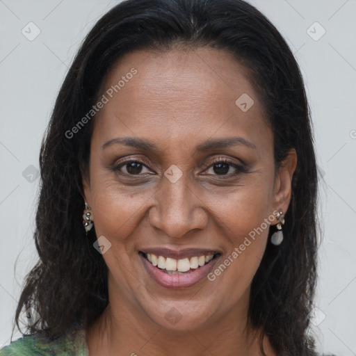 Joyful black adult female with long  brown hair and brown eyes