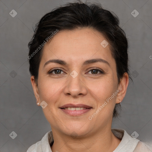 Joyful white adult female with short  brown hair and brown eyes