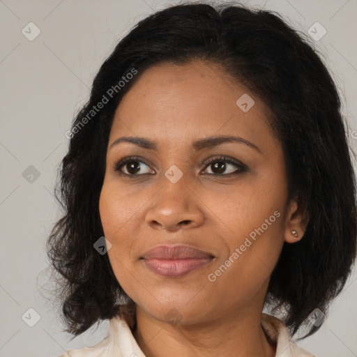 Joyful black young-adult female with medium  brown hair and brown eyes