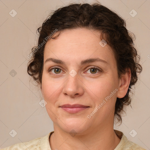 Joyful white young-adult female with medium  brown hair and green eyes