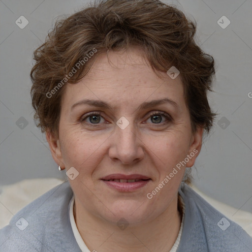 Joyful white adult female with medium  brown hair and blue eyes