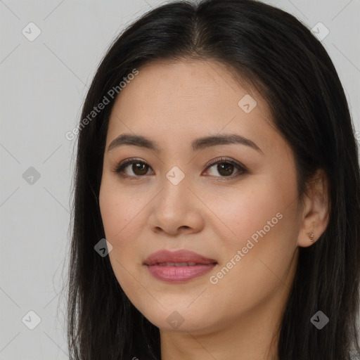 Joyful asian young-adult female with long  brown hair and brown eyes