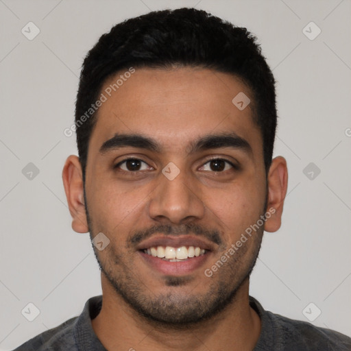 Joyful latino young-adult male with short  black hair and brown eyes