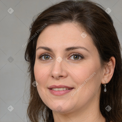 Joyful white adult female with medium  brown hair and brown eyes