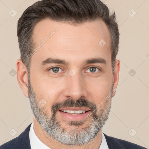 Joyful white adult male with short  brown hair and brown eyes