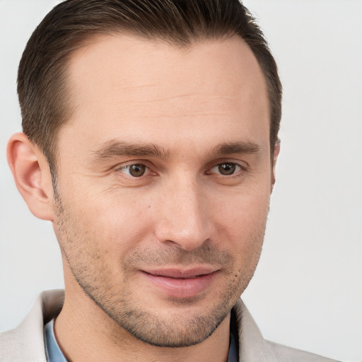 Joyful white young-adult male with short  brown hair and brown eyes