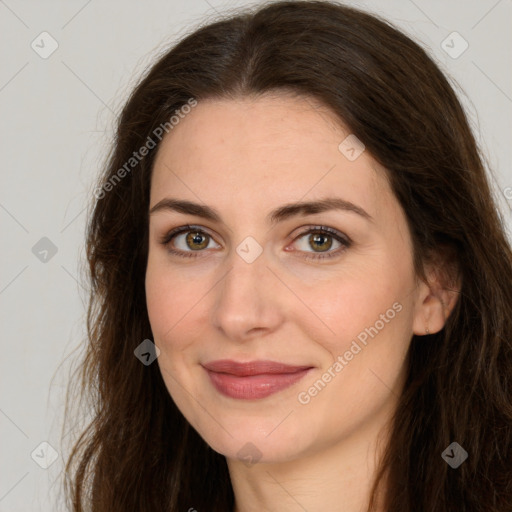 Joyful white adult female with long  brown hair and brown eyes