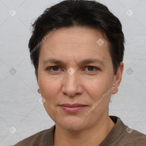 Joyful white adult female with short  brown hair and brown eyes