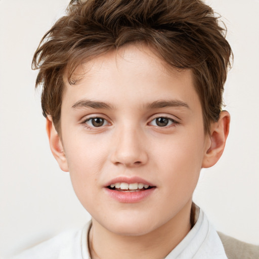 Joyful white child male with short  brown hair and brown eyes