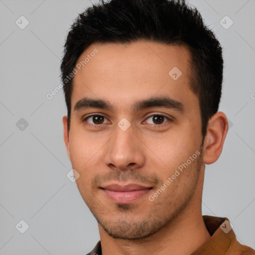 Joyful latino young-adult male with short  brown hair and brown eyes