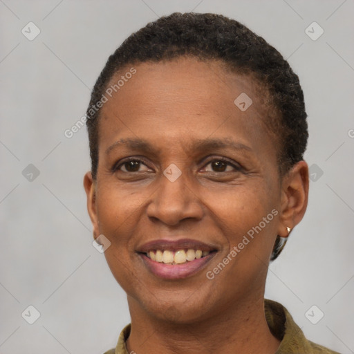 Joyful black adult female with short  brown hair and brown eyes