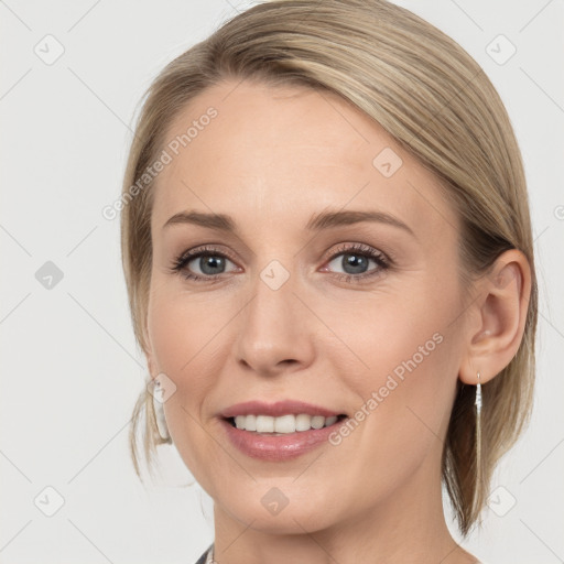 Joyful white young-adult female with medium  brown hair and blue eyes