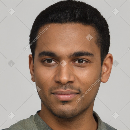 Joyful black young-adult male with short  black hair and brown eyes