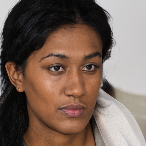 Neutral black young-adult female with long  brown hair and brown eyes