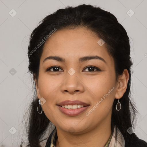 Joyful latino young-adult female with long  brown hair and brown eyes