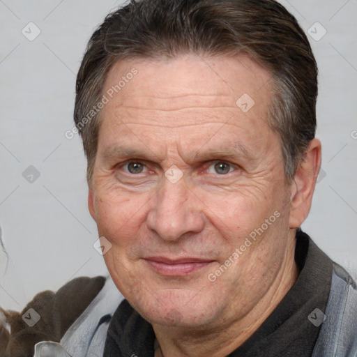 Joyful white middle-aged male with short  brown hair and brown eyes