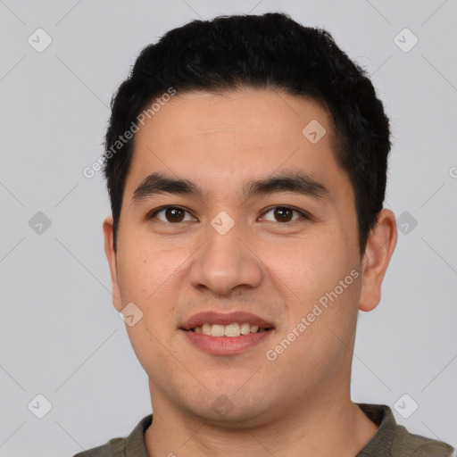 Joyful white young-adult male with short  black hair and brown eyes