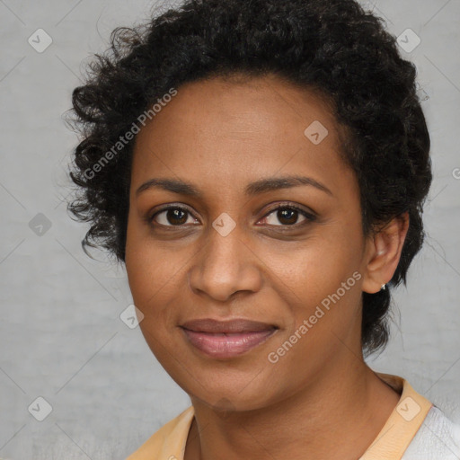 Joyful black young-adult female with short  brown hair and brown eyes