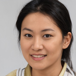 Joyful asian young-adult female with medium  brown hair and brown eyes