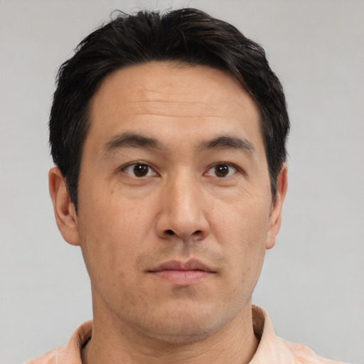 Neutral asian adult male with short  brown hair and brown eyes