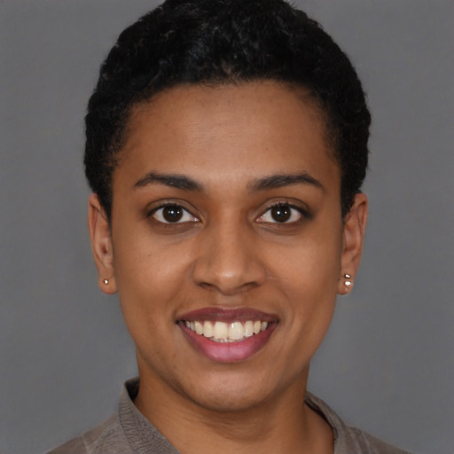 Joyful latino young-adult female with short  brown hair and brown eyes