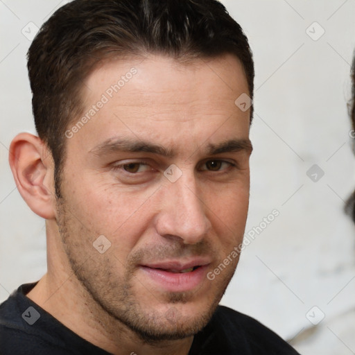 Joyful white adult male with short  brown hair and brown eyes