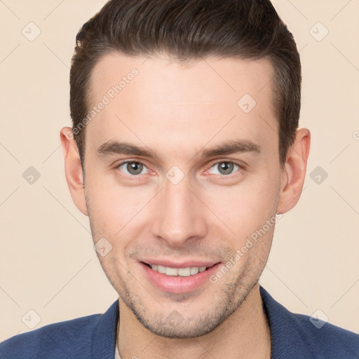 Joyful white young-adult male with short  brown hair and brown eyes