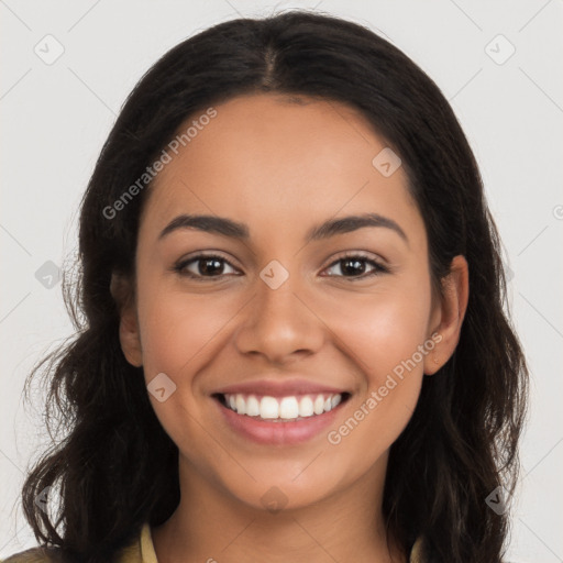 Joyful latino young-adult female with long  brown hair and brown eyes