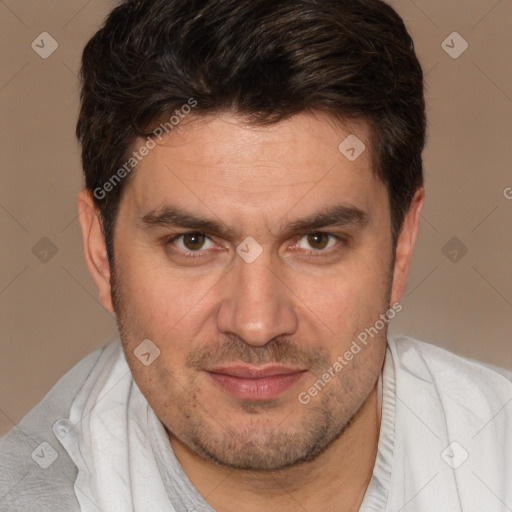 Joyful white adult male with short  brown hair and brown eyes