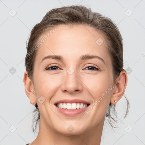 Joyful white young-adult female with medium  brown hair and grey eyes