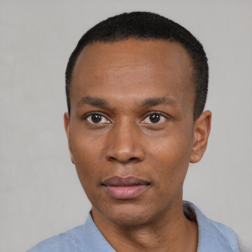 Neutral black young-adult male with short  black hair and brown eyes