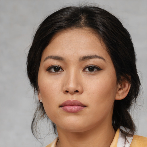 Neutral asian young-adult female with medium  brown hair and brown eyes