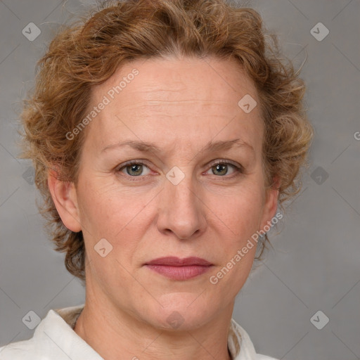 Joyful white adult female with medium  brown hair and blue eyes