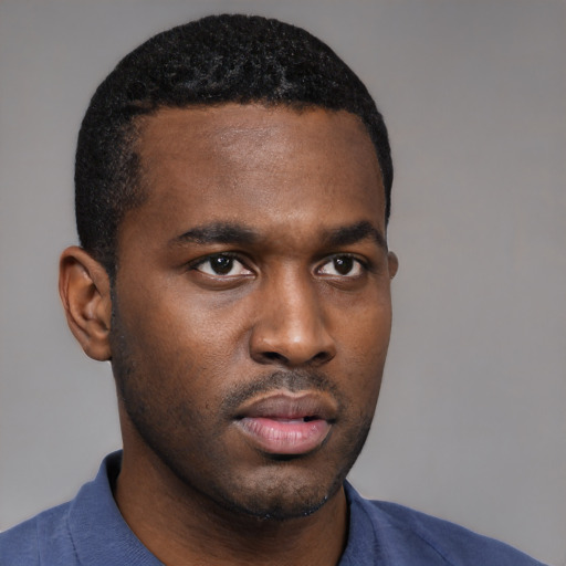 Neutral black young-adult male with short  black hair and brown eyes