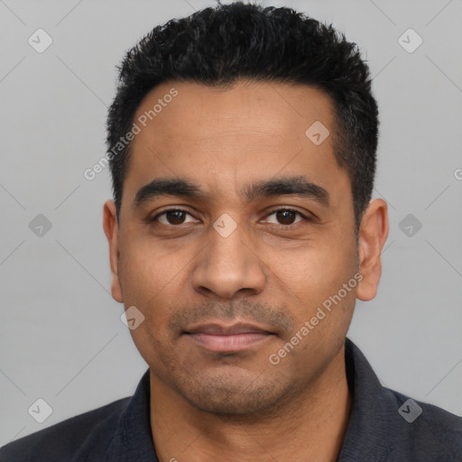 Joyful latino young-adult male with short  black hair and brown eyes