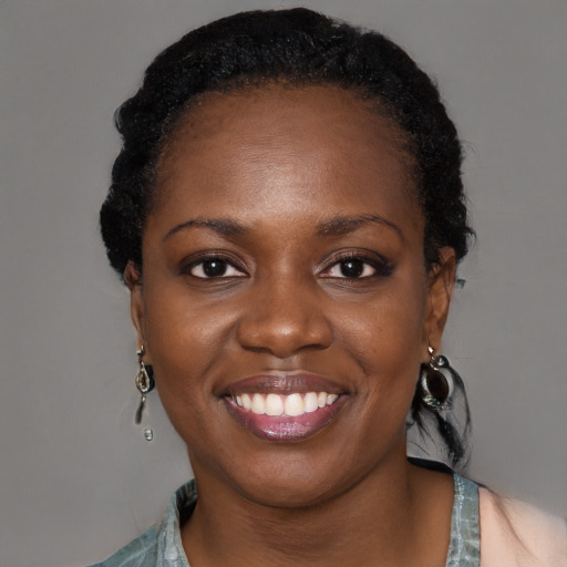 Joyful black young-adult female with medium  black hair and brown eyes