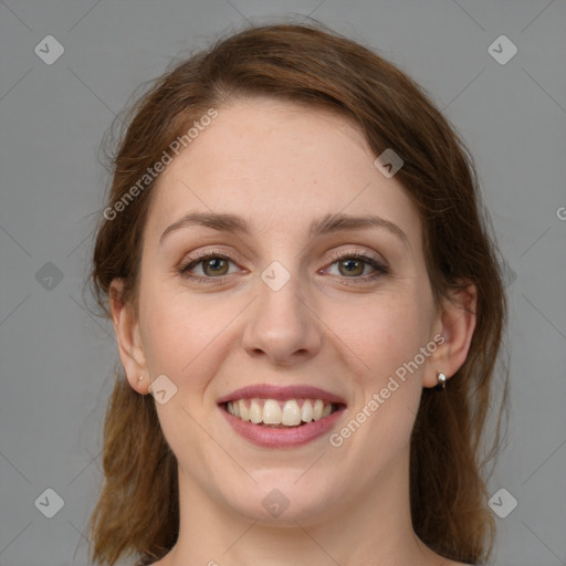 Joyful white young-adult female with medium  brown hair and green eyes