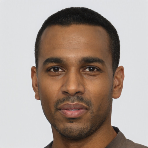 Neutral black young-adult male with short  black hair and brown eyes