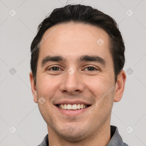 Joyful white young-adult male with short  brown hair and brown eyes