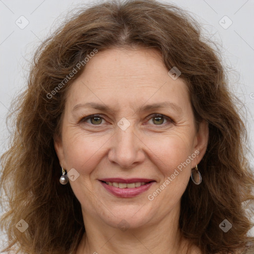 Joyful white adult female with long  brown hair and brown eyes