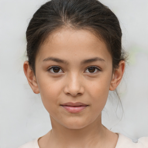 Joyful white child female with short  brown hair and brown eyes