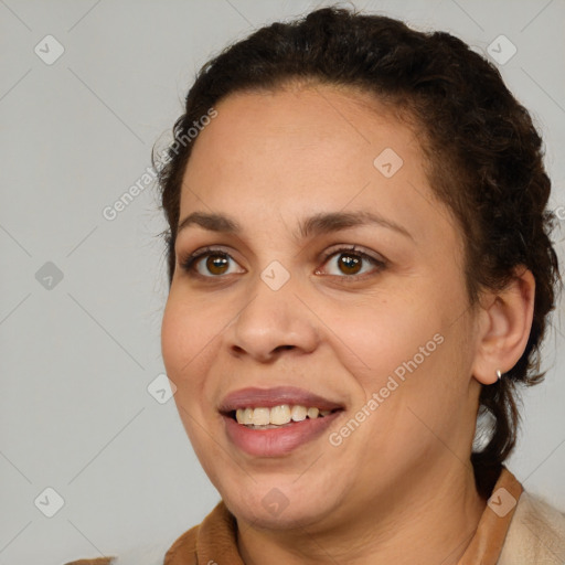 Joyful white adult female with medium  brown hair and brown eyes