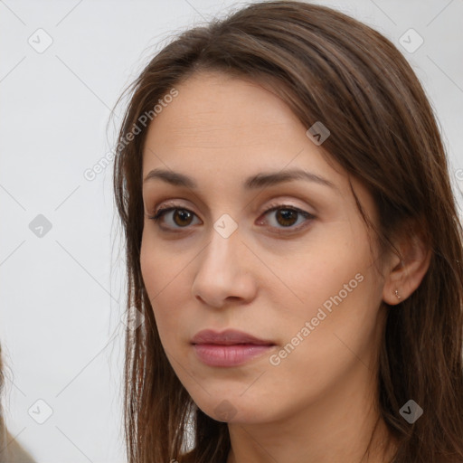 Neutral white young-adult female with long  brown hair and brown eyes