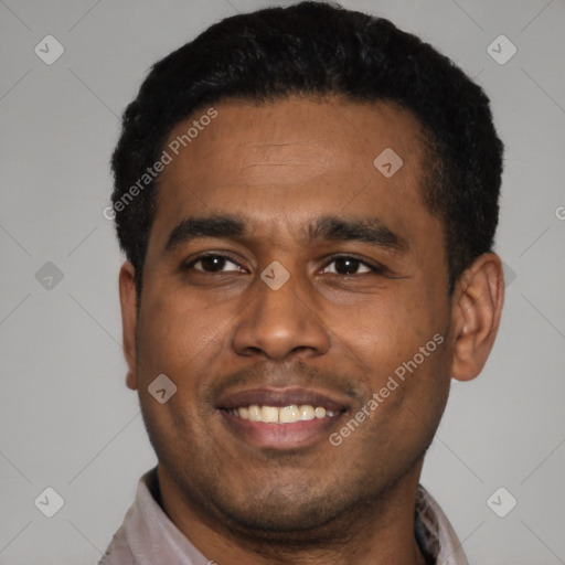 Joyful latino young-adult male with short  black hair and brown eyes