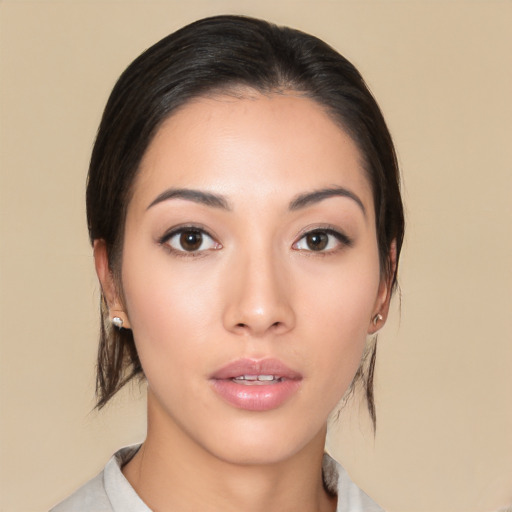 Neutral asian young-adult female with medium  brown hair and brown eyes