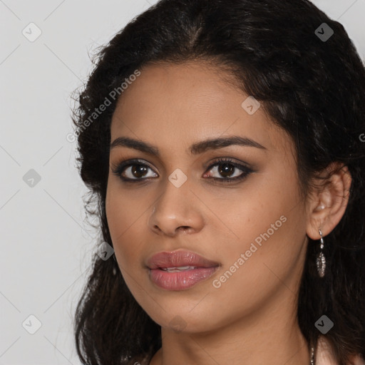 Joyful latino young-adult female with long  brown hair and brown eyes