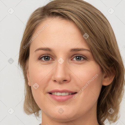 Joyful white young-adult female with medium  brown hair and green eyes