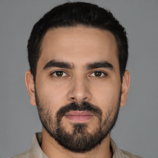 Neutral latino young-adult male with short  black hair and brown eyes