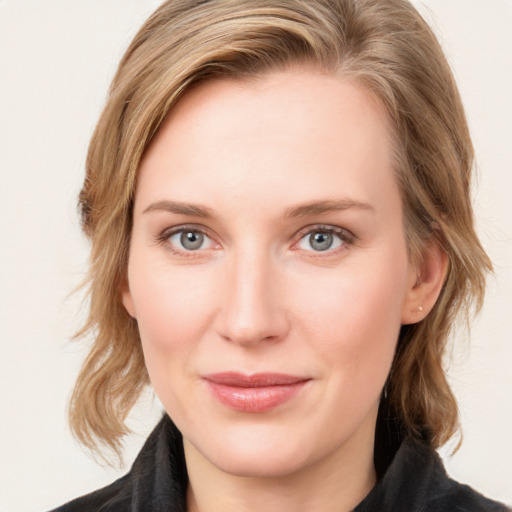 Joyful white young-adult female with medium  brown hair and blue eyes