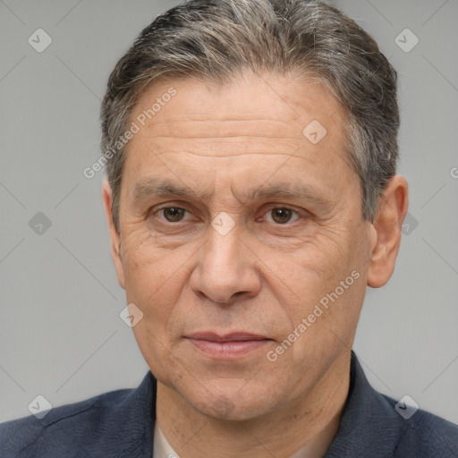 Joyful white middle-aged male with short  brown hair and brown eyes